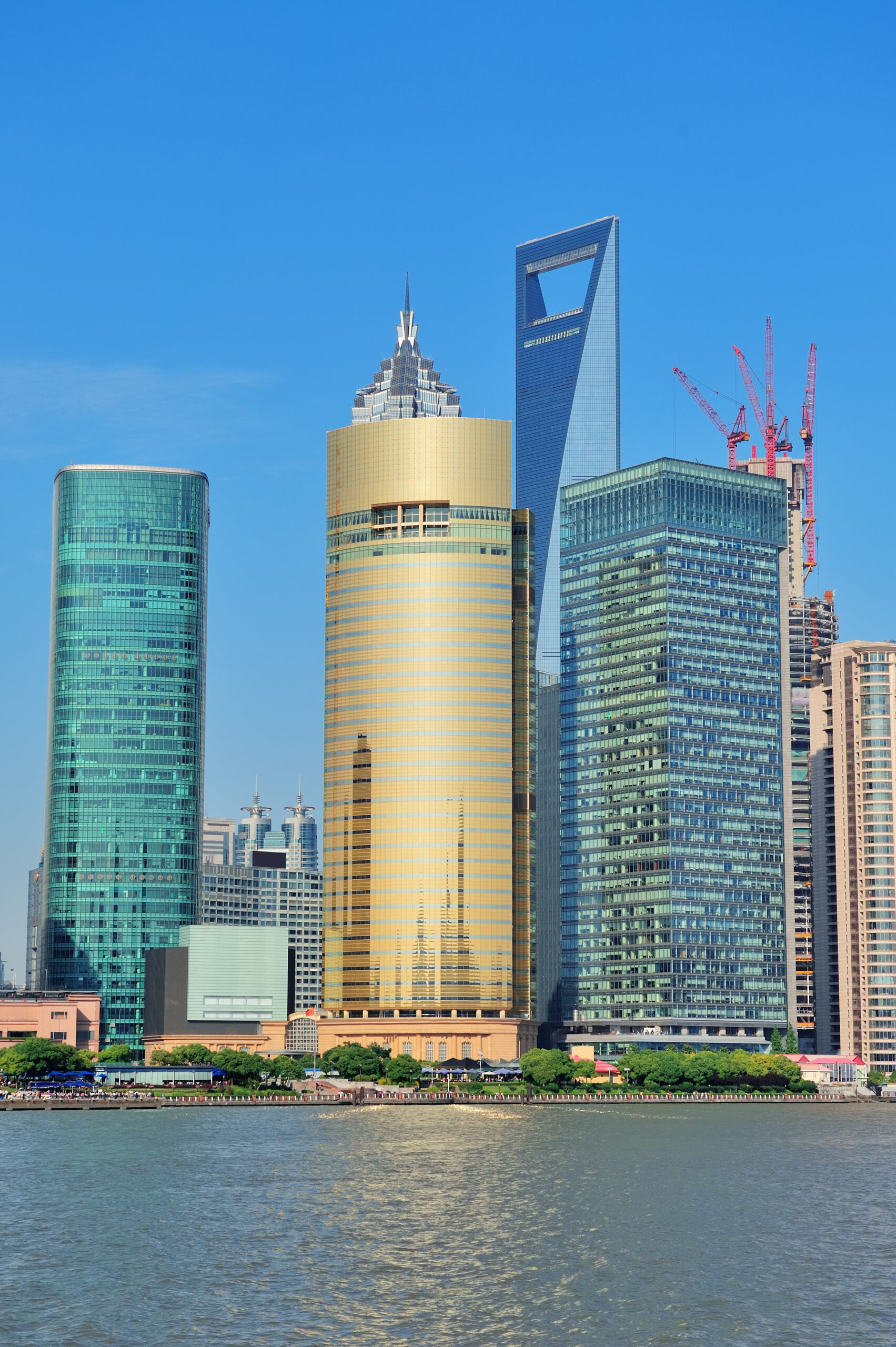 Shanghai skyline with skyscrapers and blue clear sky over Huangpu River.